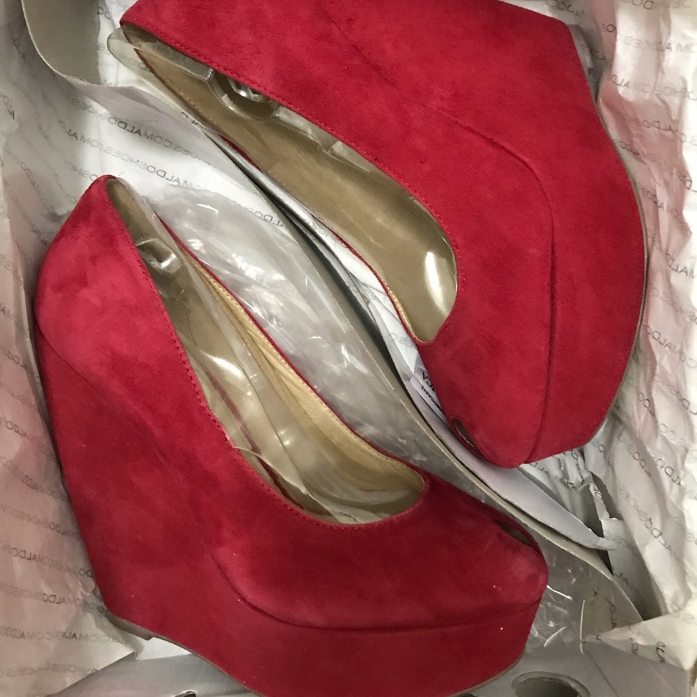 Red wedge pumps